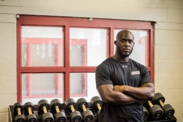 Leonard Fournette standing in front of weights.