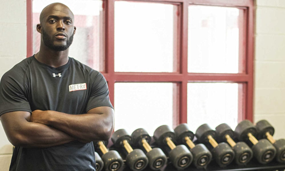 Leonard Fournette standing in front of weights.
